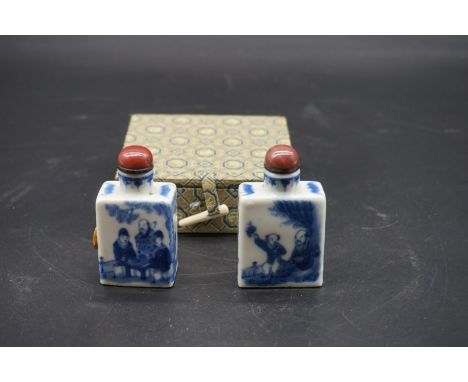 Two similar Chinese blue and white snuff bottles and stoppers, largest 7cm high, in one fitted box. 