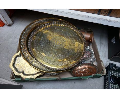 A collection of metalware,&nbsp;to include a copper powder flask; and two brass trays, largest 45.5cm diameter. 