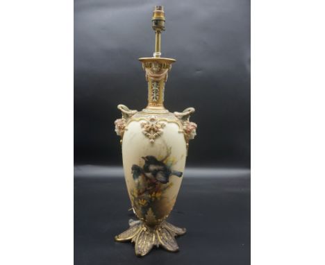 A large and impressive Royal Worcester twin handled table lamp,&nbsp;painted with magpies on gorse, by C Baldwin, height excl