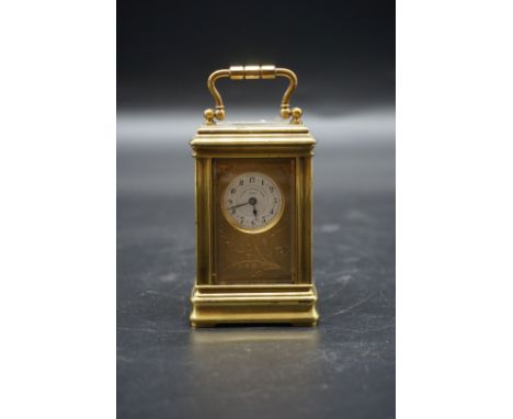 A good miniature antique brass carriage timepiece,&nbsp;the enamel dial inscribed 'A Golay Leresche &amp; Fils, Geneve', heig