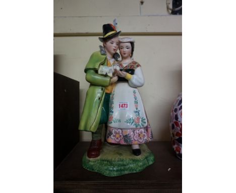 A vintage Italian pottery figure group, in the manner of Lenci, indistinct impressed marks, 37cm high.&nbsp; 