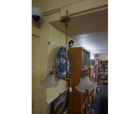 A brass twin branch ceiling light, with frosted glass shades, 66cm high x 54cm wide.&nbsp;&nbsp; 