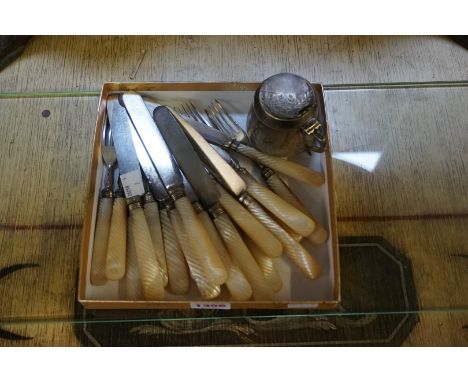 A Victorian Aesthetic EPNS mustard pot, 7cm high; together with a part set of mother-of-pearl handled knives and forks. (20) 