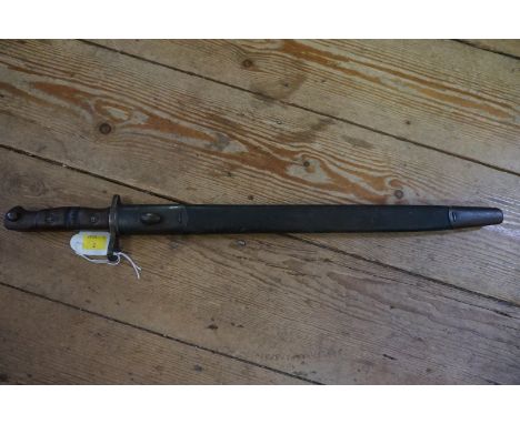 A Remington 1913 pattern bayonet and leather scabbard, with 43cm blade.&nbsp; 