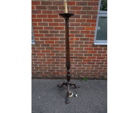 An old mahogany tripod standard lamp. 