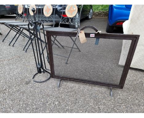 A contemporary steel fireguard, by Garden Trading; together with a similar companion set. 