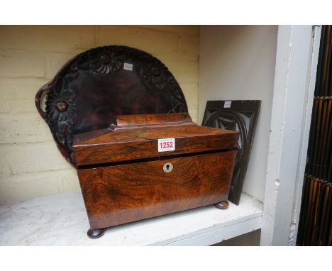 A 19th century rosewood sarcophagus tea caddy, 31cm wide; together with a Japanese lacquer tray, 43cm diameter; and a carved 