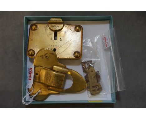 A circa 1900 Louis Vuitton brass trunk lock, No.012685. 