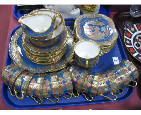 An Early XX Century Tea Service, of thirty nine pieces, heavily decorated in gilt, with pagoda and chinoiserie sconces, all o