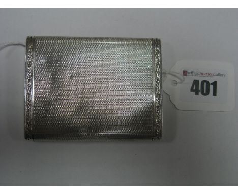 A Hallmarked Silver Cigarette Case, allover engine turned with engrave bands, and flush push button close, 8.4cm long.