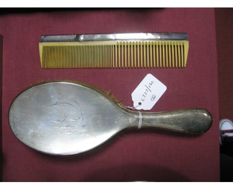 A Chester Hallmarked Silver Backed Hair Brush, initialled; together with a hallmarked silver mounted comb. (2)