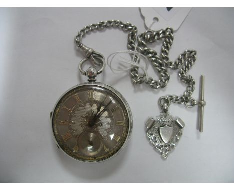 A Hallmarked Silver Cased Openface Pocketwatch, the foliate engraved dial with italic Roman numerals and seconds subsidiary d