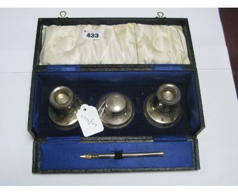 A Matched Hallmarked Silver Desk Set, (marks rubbed) comprising pair of candlesticks, inkwell and pen, contained in original 