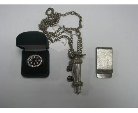 A Victorian Military Beaufort Whistle, on long chain; together with a money clip with applied racehorses and an openwork broo