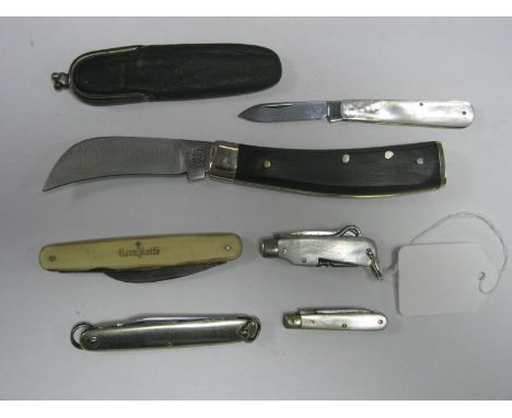 An A. Wright & Son Ltd Sheffield Single Blade Folding Pruning Knife; together with a corn knife, a small multi function foldi