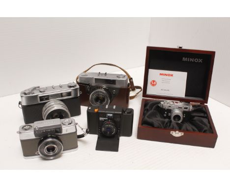 Cameras, a Minox Leica M3 minature camera together with a small group of other 35 mm cameras 