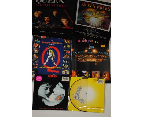 Books & 7" Vinyl, twelve 'Freddie Mercury Tribute', two 'A Magic Tour' plus other books together with six 7" pink vinyl and s