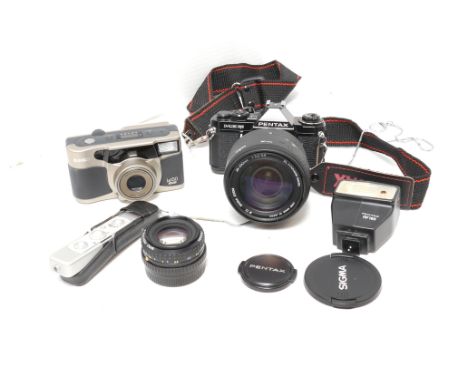 A Pentax ME Super Camera,  black, with Minox B and more (a lot)