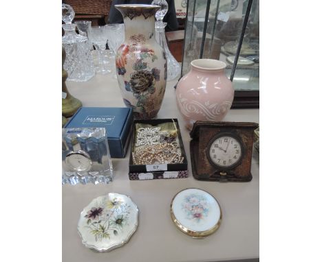 A selection of costume jewellery, two Stratton machine tooled and enamelled compacts, a vintage travel clock finished in leat