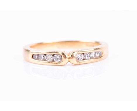 An 18ct yellow gold and diamond wishbone-style ring, the two sides channel-set with small round brilliant-cut diamonds, size 
