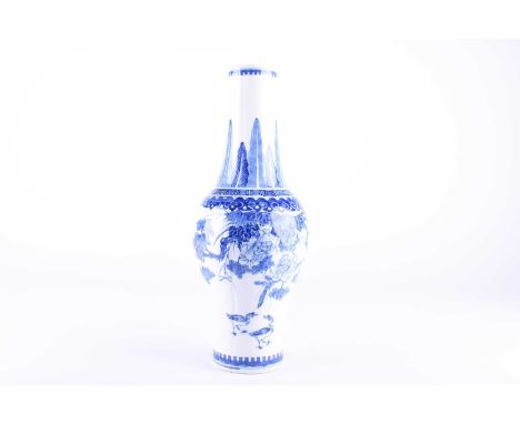 A Chinese blue &amp; white vase, the slightly lobed and inverted tapering neck painted with leaves above the inverted baluste