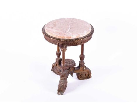 A gilt gesso marble topped occasional table, the inset pink veined marble top with a moulded ovolo border, supported on three