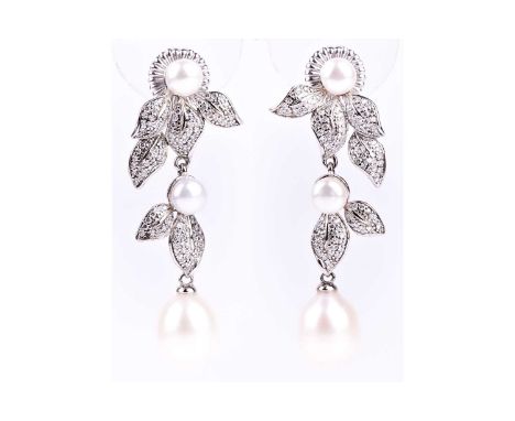 A pair of silver, pearl, and cubic zirconia drop earrings, the mounts of foliate design pave-set with cubic zirconias, with t