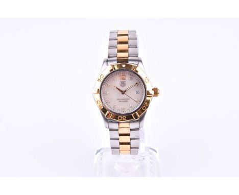 A Tag Heuer Aquaracer lady's wrist watch the mother of pearl dial with diamond hour markers and date aperture, with gilt beze