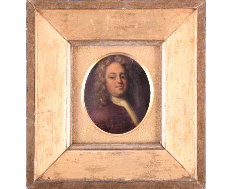 An 18th century oval portrait miniature of a gentleman, bust length, oil on copper, 7 cm x 5.6 cm, glazed in a gilt frame.