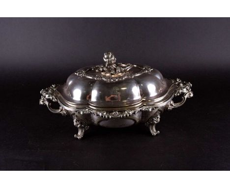 An impressive Victorian silver plated tureen, with removable internal section, foilate finial and scroll design, on four feet
