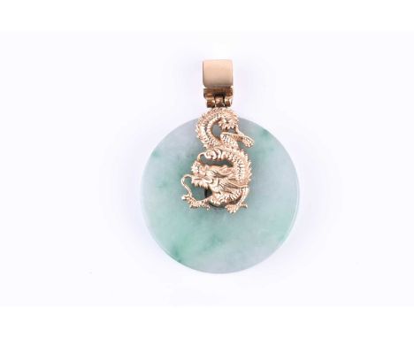 A silver gilt and jade pendant, the mount in the form of a stylised dragon, indistinct mark 925 to top of suspension loop, an
