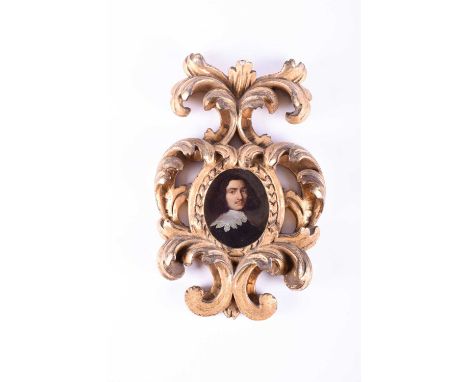 A 17th century oval portrait miniature of a gentleman, bust length wearing a white lace collar, oil on copper, 7.5 cm x 6.3 c