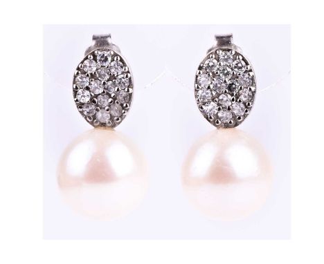 A pair of silver, cubic zirconia, and pearl drop earrings, the oval mount pave-set with round-cut CZs above a round white Sou