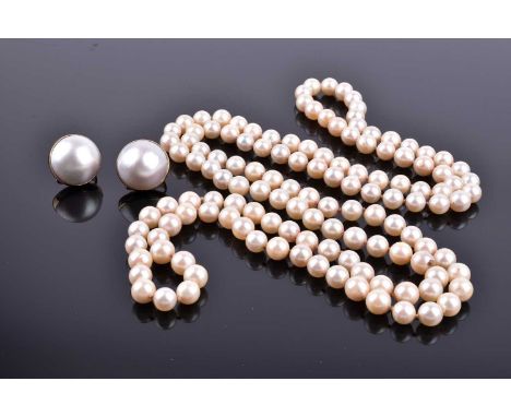 A pair of yellow metal and rounded Mabe-style white pearl earrings, clip and stem fastens, 1.9 mm diameter, together with a c