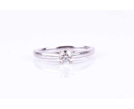 A 14ct white gold and diamond solitaire ring, set with a round brilliant-cut diamond of approximately 0.33 carats, approximat