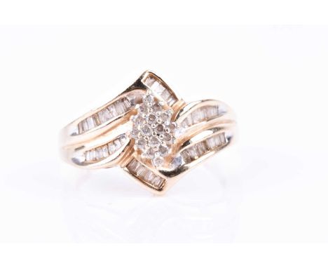 A yellow metal and diamond ring, the crossover mount centred with a marquise-shaped cluster, the mount channel-set with mixed