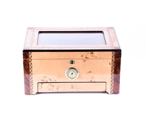 A contemporary walnut veneer and inlaid cigar humidor, with glass top, inset hydrometer and lower drawer, 35 cm x 18 cm x 24.