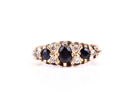 An 18ct yellow gold, diamond, and sapphire ringset with an oval-cut and two round-cut sapphires, and six round brilliant-cut 