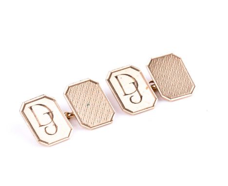 A pair of 9ct yellow gold engine-turned cufflinks, each plaque of chamfered rectangular form, with initials DJ, hallmarked.Co
