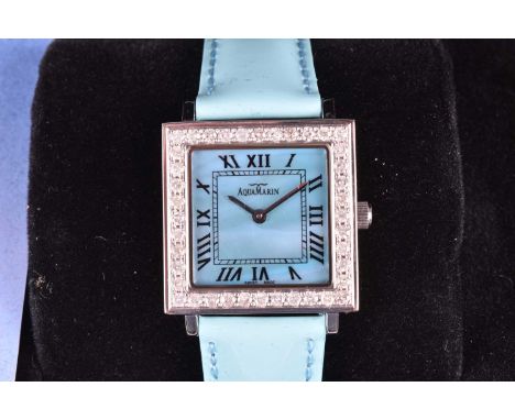 An Aqua Marin dress watch, with square mother-of-pearl dial, quartz movement, on a turquoise leather strap, with box and guar