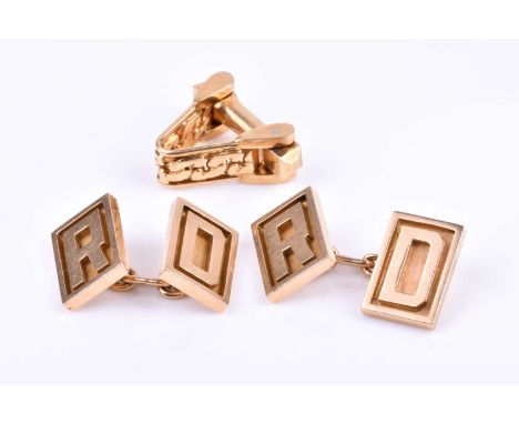 A pair of yellow metal cufflinks, the rectangular faces designed as an 'R' and a 'D', marked 18K, together with an unusual si