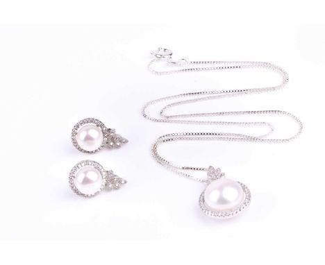 A silver, cubic zirconia, and pearl pendant, the pearl approximately 11 mm, together with a pair of matching earrings, the pe