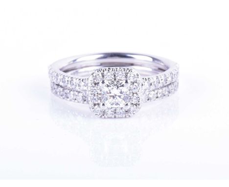 A 14ct white gold and diamond ring by Hearts on Firethe double diamond band centred with a princess-cut diamond of approximat