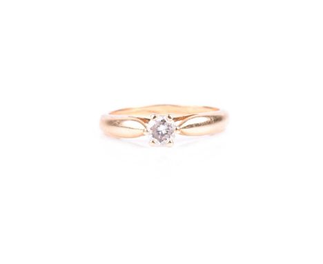 A yellow metal and solitaire diamond ring, set with a round brilliant-cut diamond of approximately 0.33 carats, approximate c