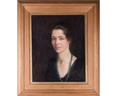 Flora Lion (1876-1958) British, a head and shoulders portrait of a lady, her hair tied up and wearing a green beaded necklace