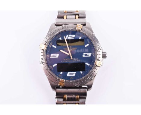 A Breitling Aerospace titanium digital wristwatch the blue dial with large numerals, and two digital readouts, with rotating 
