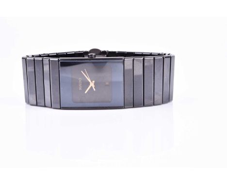 A Rado Jubile Diastar ladies black polished ceramic wristwatch, the minimalist rectangular dial with gilt hands and date aper