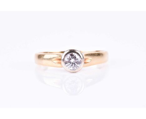 An 18ct yellow gold and diamond ring, the bezel set round brilliant-cut diamond of approximately 0.25 carats, approximate col