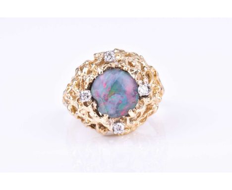 A 14k yellow gold, diamond, and opal ringin the Modernist taste, set with a round cabochon opal triplet, with four small diam