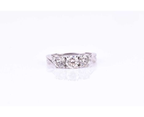 A three stone diamond ring, set with a round brilliant-cut 0.33 carat diamond, flanked with two round brilliant-cut diamonds 